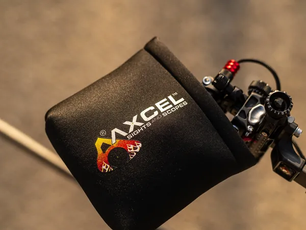 Black Axcel scope cover on a bow sight